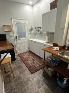 a kitchen with a sink and a tub at GFU neighborhood and Oregon Wine Country studio in Newberg