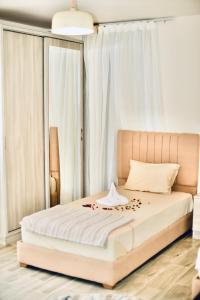 Ένα ή περισσότερα κρεβάτια σε δωμάτιο στο Legend Pyramids Inn