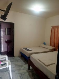 Ένα ή περισσότερα κρεβάτια σε δωμάτιο στο Casa en playas