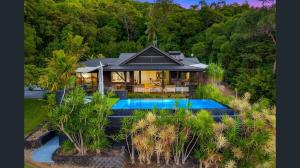 an aerial view of a house with a swimming pool at Exclusive Isolated Getaway Mowbray Port Douglas in Mowbray