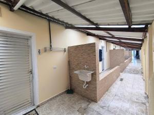 a bathroom with a sink on the wall at Pousada Mar e Luz in Ilha Comprida +46 photos