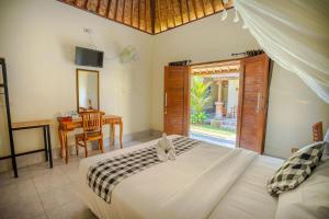 Postel nebo postele na pokoji v ubytování Pondok Sayan Homestay + 62 fotografií