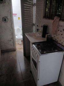 Kuchyň nebo kuchyňský kout v ubytování Quarto do Corredor