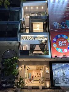 a building with a hotel ambassador sign on it at Aura Beachfront Hotel - Apartment in Da Nang
