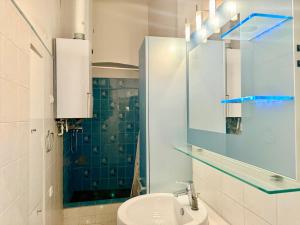 a bathroom with a sink and a mirror at Spacious Classical Style Apartment in Vienna