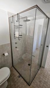 a glass shower in a bathroom with a toilet at Emerald Break- The Perfect Coastal Escape in Emerald Beach +37 photos