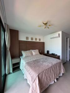 a bedroom with a bed and a ceiling fan at Studio Fortal in Fortaleza +28 photos