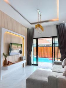 Postel nebo postele na pokoji v ubytování Jaegun Pool VIlla Aonang + 30 fotografií