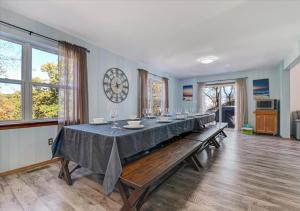 a long dining room with a long table at Lakefront Kayaks, HotTub FirePit Sauna Pool in East Stroudsburg