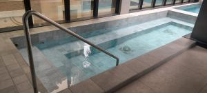 a large swimming pool with at Flat Infinity 1504 Vista Mar in Itapema