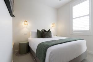 En eller flere senge i et værelse på Walter Street Retreat