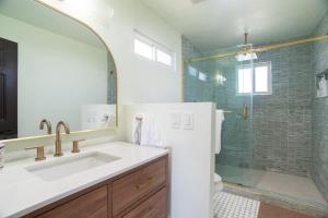 a bathroom with a sink and a shower at Rosarito Rosé in Las Gaviotas +19 photos