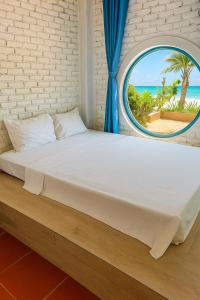 Postel nebo postele na pokoji v ubytování Fresco Village