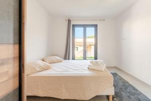 a bedroom with a bed and a mirror at L'Oasis de Saint-Quentin in Saint-Quentin-la-Poterie +38 photos