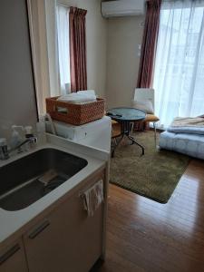 Ένα ή περισσότερα κρεβάτια σε δωμάτιο στο れのん