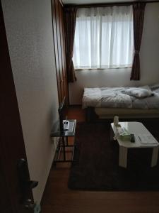 Ένα ή περισσότερα κρεβάτια σε δωμάτιο στο れのん