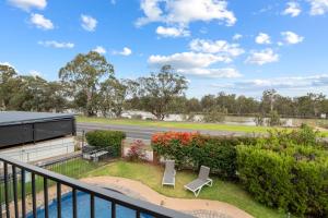 a view from the balcony of a house with a garden at Mildura Riverview Motel in Gol Gol