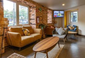 Χώρος καθιστικού στο Hotel Estancias VIVE MX Cuauhtemoc, Trademark by Wyndham