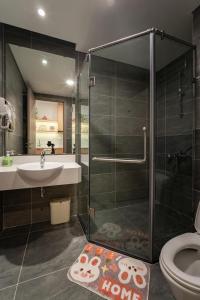 a bathroom with a shower and a sink and a toilet at La Vie Eco in HÆ°ng YÃªn
