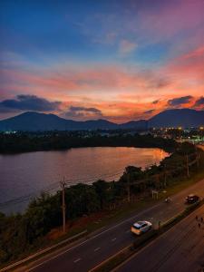 a view of a road with a river and a sunset at The Azure Kathu in Kathu