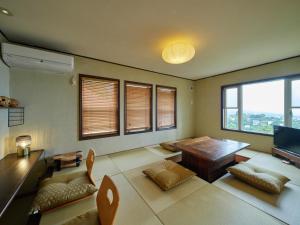 En eller flere senge i et værelse på Atami Base-熱海ベース-