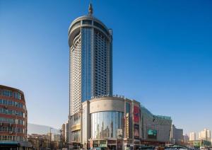 a large building with a dome on top of it at Mercure Lanzhou Dongfanghong Square Hotel in Lanzhou