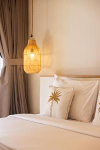 Ένα ή περισσότερα κρεβάτια σε δωμάτιο στο Nativo Lombok Hotel +17 φωτογραφίες