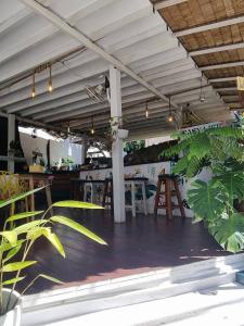 a patio with a table and chairs under a roof at Easy Life Koh Chang in Ko Chang +32 photos