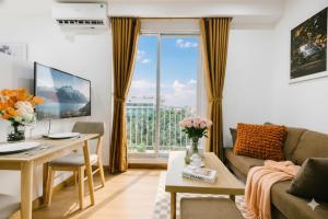 a living room with a couch and a table at Label6 Studio West Lake in Hanoi