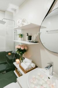 a bathroom with a sink and a mirror at Label6 Studio West Lake in Hanoi +101 photos