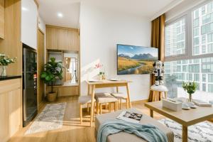 a kitchen and living room with a table and a dining room at Label6 Studio West Lake in Hanoi