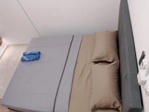 a large bed in a room with a mattress at The Duta Loft in Bandar Puncak Alam