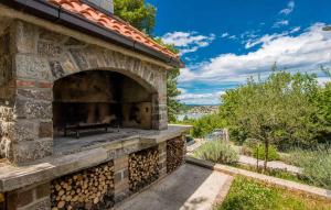 a brick fireplace with a bench inside of it at Apartments in Soline - Insel Krk 41809 in Soline
