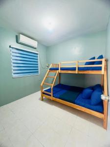 Postel nebo postele na pokoji v ubytování YAM Gensan Transient