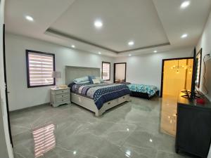 Ένα ή περισσότερα κρεβάτια σε δωμάτιο στο Villa Magna - lujo, diseño y comodidad en Ensenada