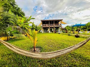 a hammock in a yard in front of a house at Vvillage 