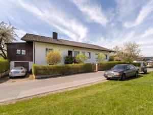 two cars parked in front of a house at Ferienhaus in Bayern am Großer Arber in Bad Koetzting