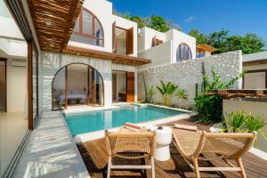 an image of a villa with a swimming pool at Villa Cove 5 by BaliSuperHost in Uluwatu
