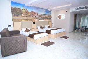 Postel nebo postele na pokoji v ubytování Prasad Trivene Resorts