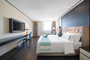 TV a/nebo společenská místnost v ubytování Xana Hotelle Jinan Daminghu North Gate