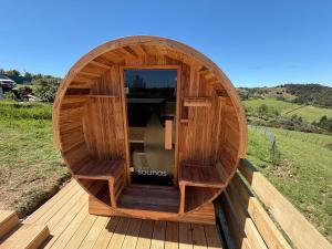 a small wooden boat sitting on a wooden deck at Whitford Serenity Villa in Whitford