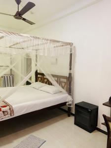 Postel nebo postele na pokoji v ubytování Serene Lumina Mirissa