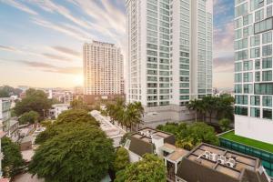an aerial view of a city with tall buildings at Label6 Studio West Lake in Hanoi