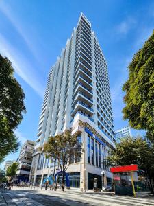 a large white building on a city street at Paramion Hotel in Busan