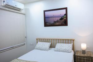 Ένα ή περισσότερα κρεβάτια σε δωμάτιο στο Lalit Villa Luxury Apartments +18 φωτογραφίες