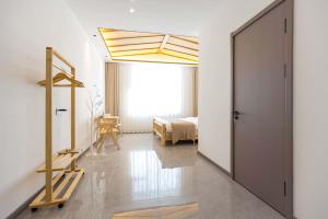 Ένα ή περισσότερα κρεβάτια σε δωμάτιο στο Xuegu Xuefu Lai Inn