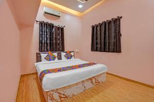 a bedroom with a large bed in a room at Via The Heaven in Pune