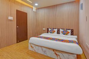 a bedroom with a large bed in a room at Via The Heaven in Pune +17 photos