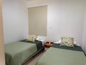 Giường trong phòng chung tại Bonito Depa Cerca de la Playa +46 ảnh