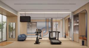 een weergave van een sportschool met loopbanden en een flatscreen-tv bij Holiday Inn Express Shenzhen Sports Center by IHG in Shenzhen
